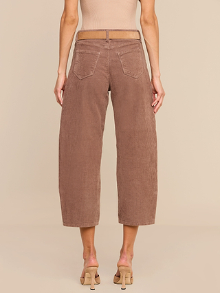 Wearing the Mallis Corduroy Bow-Leg Pant in a high-rise, wide-leg silhouette with beige heeled sandals, this look—shown from the back against a beige background—is perfect for adding a relaxed touch to any casual wardrobe.