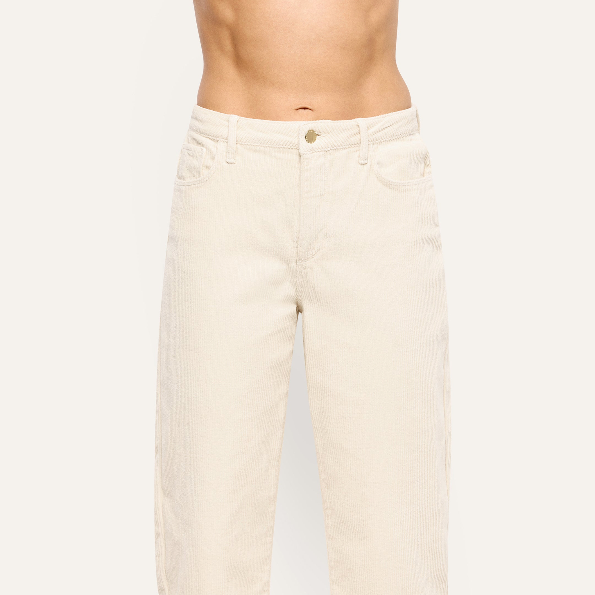 Mallis Corduroy Bow-Leg Pant in cream-colored stretch corduroy with a high-rise fit and a wide-leg silhouette.