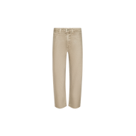 Beige, high-rise, wide-leg Mallis Coated Bow-Leg Jean with a slight curve through the legs.