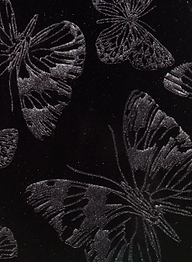Silver butterflies with intricately detailed wings are illustrated on a black background, creating a shimmering, elegant print that adds sophistication to the Frances Bootcut Trouser in stretch velvet or velvet.