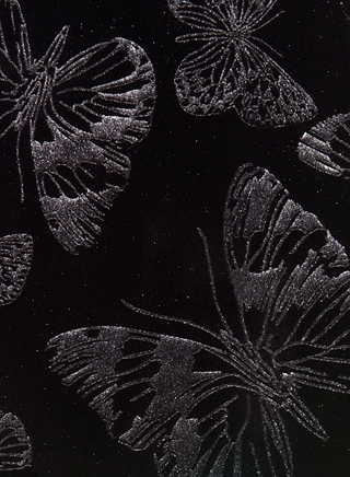 Silver glitter outlines of butterflies on a black background create a shimmering, elegant print—perfect for adding a touch of sophistication to the Frances Bootcut Trouser.