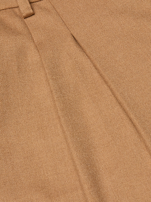Close-up of the Chelsy Wide-Leg Pant in light brown, featuring a fine textured weave, diagonal seam, visible stitching detail, and sturdy cotton-like material for a structured, high-waisted fit.