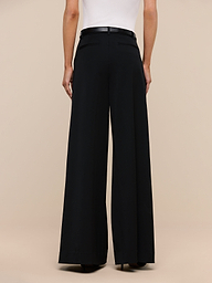 A person is shown from the back against a plain white background, wearing the Chelsy Wide-Leg Pant and a white top.