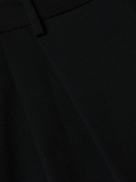 Close-up of the Chelsy Wide-Leg Pant in black textured fabric, showcasing its visible seam and waistband.