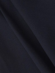 Close-up of the Chelsy Wide-Leg Pant in dark navy blue stretch fabric, featuring a diagonal crease that highlights the smooth texture and subtle folds.