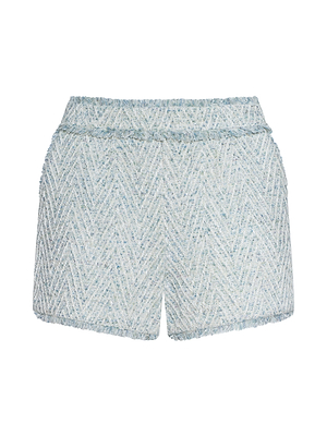 The Ashley Tweed Short features light blue and white chevron tweed, a classic silhouette, fitted waistband, and slightly textured fabric for a structured look with timeless appeal.