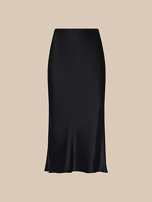 The Perin Silk Midi Skirt is a black, high-waisted skirt made from silk charmeuse with a smooth, subtle sheen and midi length, shown against a plain beige background.