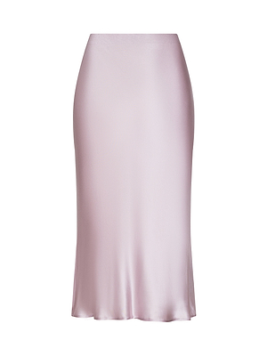 The Perin Silk Midi Skirt is a light pink, bias-cut, silk midi skirt with a smooth, shiny finish and a slightly flared hem, shown against a white background.