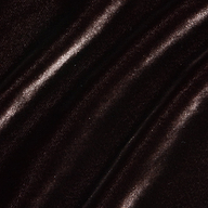 Close-up of dark brown velvet fabric with soft, diagonal folds. Light gently reflects off the plush, smooth surface—perfect for the Zeta Velvet Maxi Skirt or for adding elegant texture to a minimalist wardrobe.