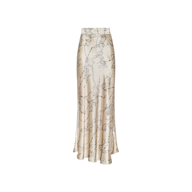 The Ryker Silk Maxi Skirt, a long, high-waisted cream satin piece adorned with a delicate floral pattern, embodies minimalist sophistication and is displayed on a plain white background.