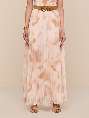 A woman, head not visible, stands against a neutral background wearing the Torin Pleated Maxi Skirt with a wide tan belt and gold bracelet.