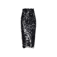 The Makena Sequin Pencil Skirt is a knee-length, pencil-shaped skirt featuring shiny black and silver sequins over a mesh base and is displayed against a white background.