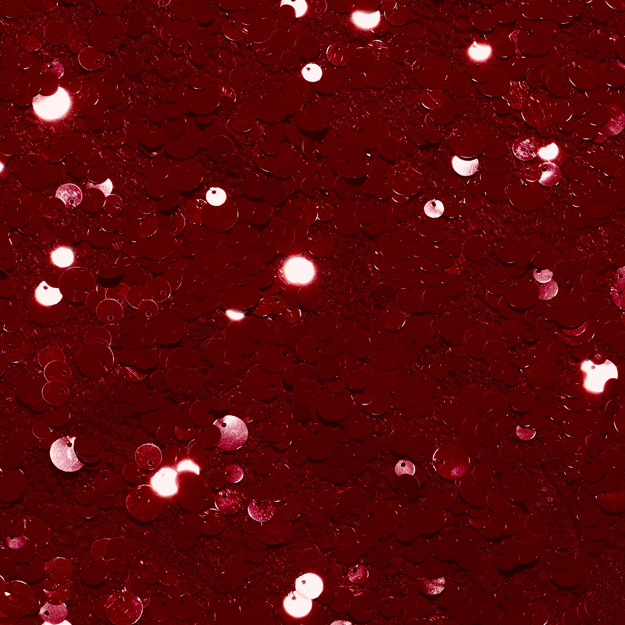 Close-up of deep red circular sequins on a Makena Sequin Pencil Skirt.