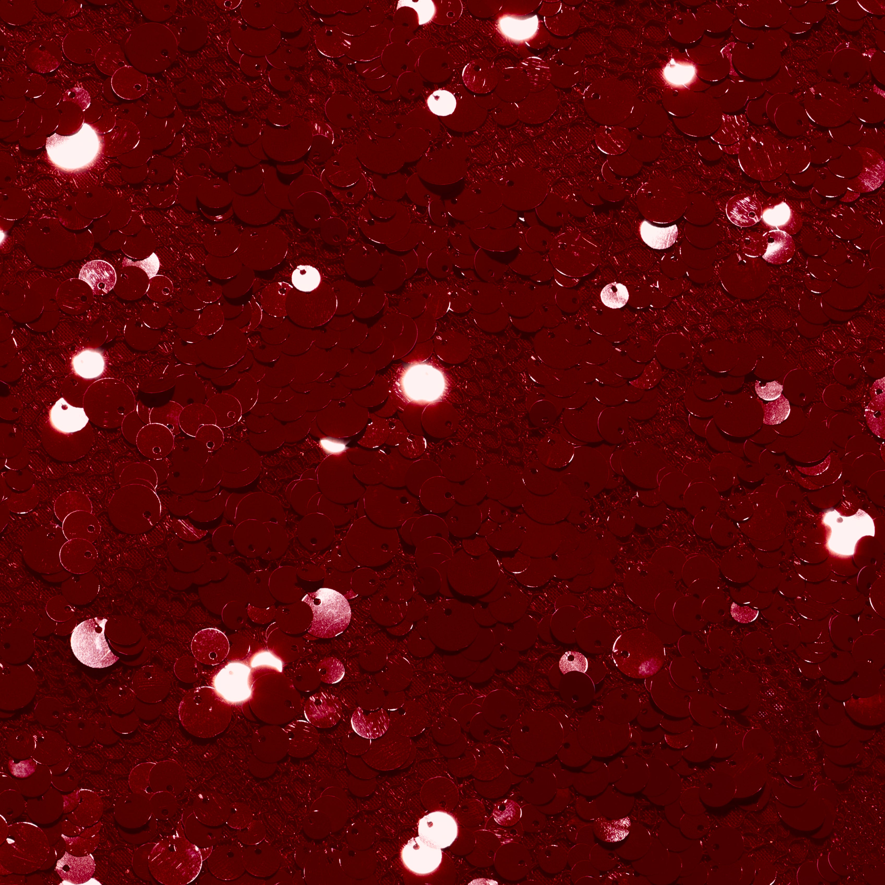Close-up of deep red circular sequins on a Makena Sequin Pencil Skirt.