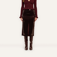 A Makena Sequin Pencil Skirt in espresso brown worn with a matching ribbed cardigan and knee-high boots, reaching below the knees.