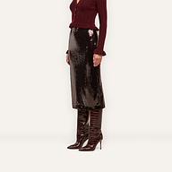 A Makena Sequin Pencil Skirt in espresso brown paired with a burgundy ribbed cardigan and tall, pointed-toe stiletto boots.