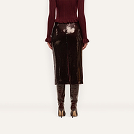 An espresso brown, sequined Makena Sequin Pencil Skirt worn with a matching sweater and heeled boots.