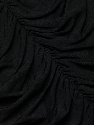 Close-up of the Isodora Mesh Midi Skirt in black stretch mesh, featuring gathered, ruched folds that create a textured, wavy pattern. The soft material has a slight sheen, with shadows highlighting the skirt's dimensional ruching.