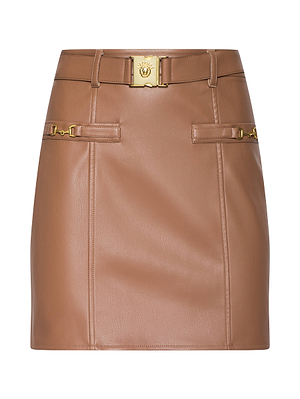 The Yvette Vegan Leather Mini Skirt features belt loops, a gold Medusa-head buckle, decorative gold front hardware, and visible seam details in a sleek, structured brown design.