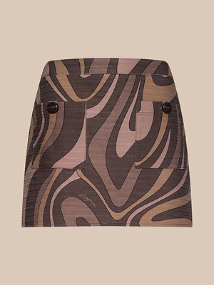 The Cyra Low-Rise Mini Skirt features a bold brown and beige abstract swirl print, two front pockets with dark buttons, and is showcased against a plain beige background.