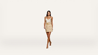 Woman with long dark hair wearing a white tank top, beige mini skirt with pockets and a belt, and beige heels, standing against a plain white background.