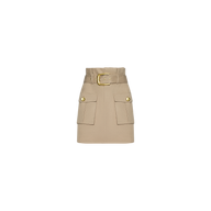 The Maelis Mini Skirt is a beige, high-rise waist skirt with a wide belt and gold buckle, featuring two large front cargo pockets adorned with gold buttons, displayed on a plain white background.