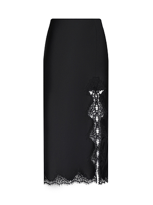 The Tico Silk Lace Skirt is a black pencil skirt with a lace-trimmed hem and a vertical eyelash lace inset on one side, shown against a white background—ideal for stylish Spring 2026 outfits.