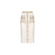 The Shae Skirt is a knee-length white floral lace skirt featuring a beige waistband, beige front buttons, and two large beige cargo pockets on the front.