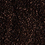 Close-up of the Dravenne Beaded Skirt, featuring dark fabric mesh densely covered in metallic brown cylindrical beads.
