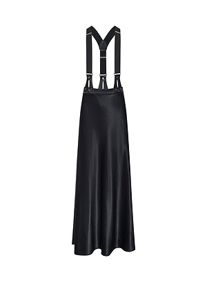 The Vespera Suspender Maxi Skirt—a black midi skirt with a sleek, shiny finish, adjustable suspenders, and silver hardware—channels New York Fashion Week energy for Fall 2026, shown on a white background.