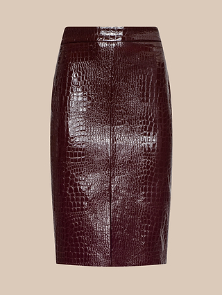 The Violetta Vegan Leather Skirt, crafted from croc-embossed vegan leather in a shiny dark burgundy hue, is displayed on a beige background. Featuring a front seam and an above-the-knee cut, this striking piece embodies the bold spirit of Fall 2026 fashion.