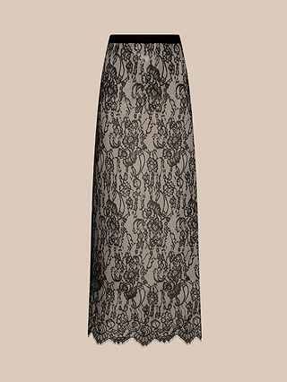 The Raymonde Lace Maxi Skirt features a beige base with a sheer black chantilly lace overlay adorned with a floral pattern and a scalloped hem—perfect for a sophisticated night out. It is displayed against a plain beige background.