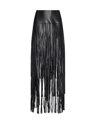 The Karoline Fringe Skirt is a black, high-waisted maxi skirt in vegan leather with long vertical fringe for a textured look. Shown on a plain white background, this dramatic piece is part of the Fall 2026 collection.