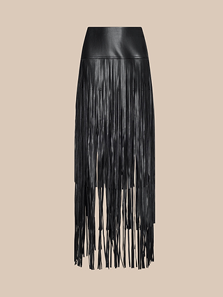 The Karoline Fringe Skirt features black vegan leather and long, thin fringe strips cascading from waist to hem, shown against a plain beige background.