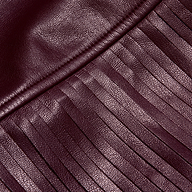 Karoline Fringe Skirt in deep burgundy vegan leather featuring a seam with long, vertical fringe.