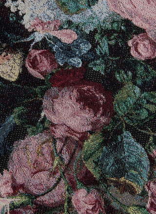 Close-up of a floral tapestry fabric with detailed pink, red, and blue flowers intertwined with green leaves, creating a textured and intricate pattern—perfect for making a wearable art statement with the Marseille Mini Skirt.