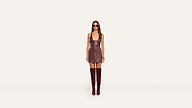 A woman wearing sunglasses, a sleeveless brown mini dress, and matching knee-high boots stands facing forward against a plain white background.