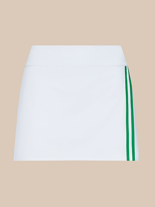 The Iga Tennis Skort, crafted from performance fabric, features a white design with two vertical green stripes on the right side and is displayed against a beige background.