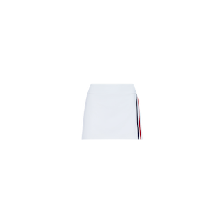 The Iga Tennis Skort is a white mini tennis skirt with a straight fit, featuring a vertical red and navy stripe along the right side. Crafted from performance fabric, it is displayed on a plain white background.