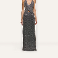 A Zeta Beaded Maxi Skirt featuring a high-waisted, floor-length silhouette covered in hand-beaded silver, paired with a matching V-neck vest.