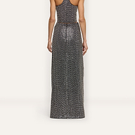 A person seen from behind wearing a hand-beaded Zeta Beaded Maxi Skirt with a matching sleeveless top.