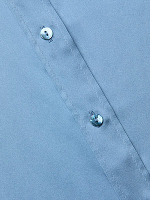 Close-up of a blue mist Dani Silk Blouse, focusing on two white buttons along the stitched placket. The silk texture and button threading are clearly visible.