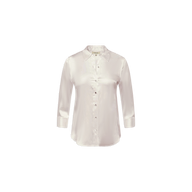 The Dani Silk Blouse is a light pink silk charmeuse shirt featuring a classic collar and three-quarter length sleeves, shown against a plain white background.