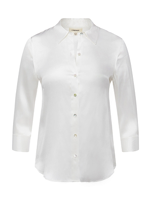 The Dani Silk Blouse, in ivory, features long sleeves, a button-down front, collared neckline, and a gently curved hem, shown against a plain white background.