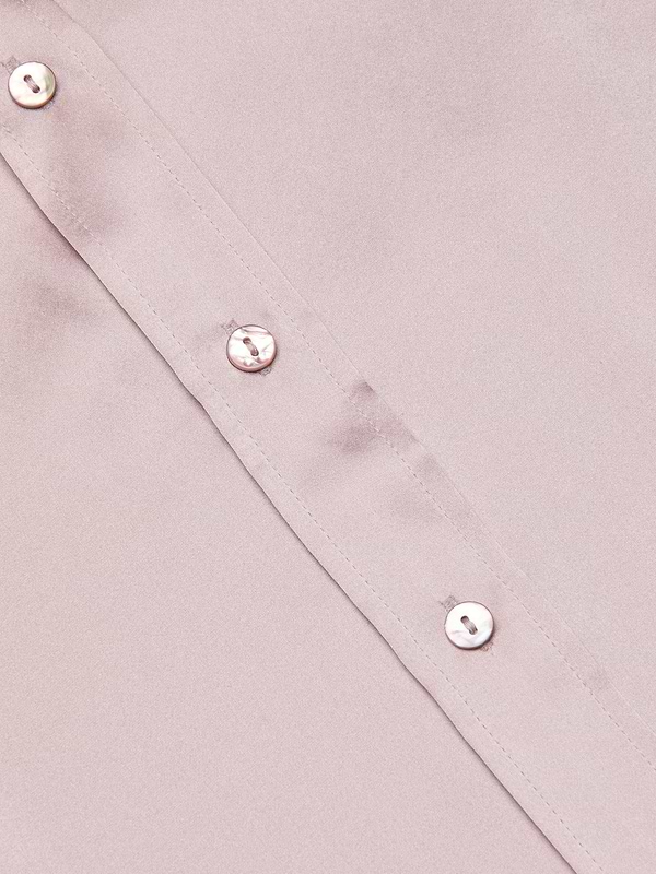 Close-up of the Dani Silk Blouse in pastel lilac, showing a diagonal view of the button placket with three shiny white buttons. The smooth, glossy silk fabric highlights the luxurious texture.