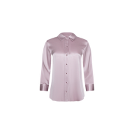 The Dani Silk Blouse, a long-sleeve, light pink button-down top with a classic collar and shiny finish, is displayed on a plain white background.