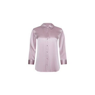 The Dani Silk Blouse, shown on a plain white background, features long sleeves, a classic collar, and buttons down the front in a light pastel lilac satin fabric.