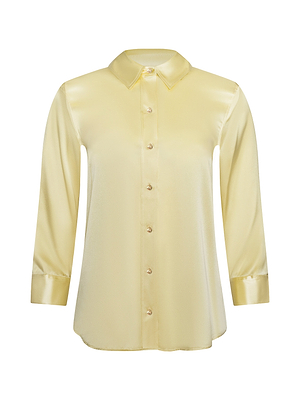 The Dani Silk Blouse is a long-sleeve, light yellow silk charmeuse shirt with a button-up front, refined pointed collar, and a smooth, shiny finish.