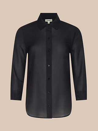 The Dani Cotton-Silk Blouse is a sheer black, long-sleeve button-down shirt featuring a classic collar, elegantly displayed against a beige background.