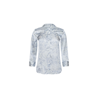 The Dani Silk Blouse is a long-sleeve, silver satin silk button-down shirt featuring a subtle floral pattern, shown against a white background.